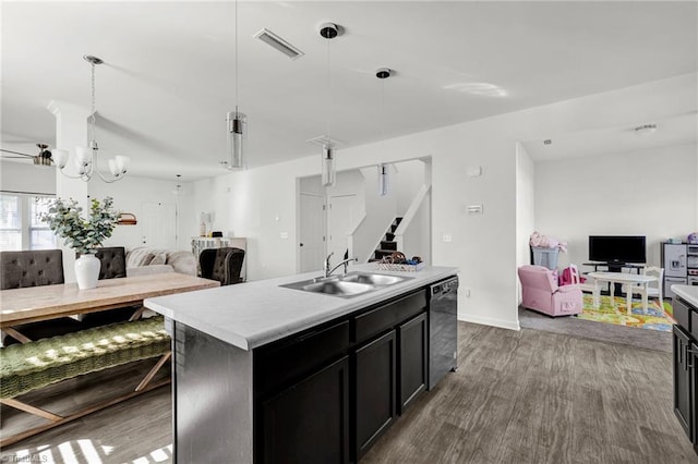 kitchen featuring sink, pendant lighting, a center island with sink, dark hardwood / wood-style flooring, and stainless steel dishwasher