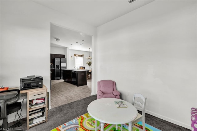 recreation room featuring carpet flooring and sink