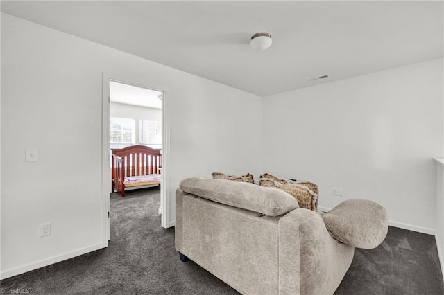 bedroom featuring dark colored carpet