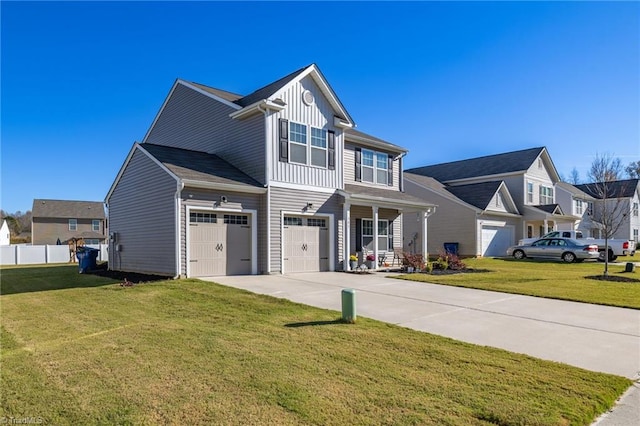 view of front of property featuring a front lawn and a garage