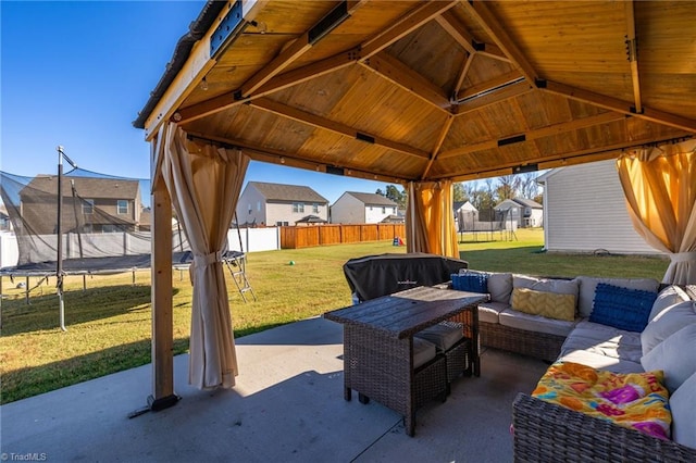 view of patio featuring a gazebo, a trampoline, and outdoor lounge area