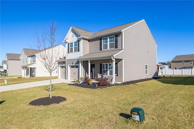 view of front of home with a front yard and a garage