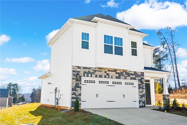 view of front facade with a garage and a front lawn