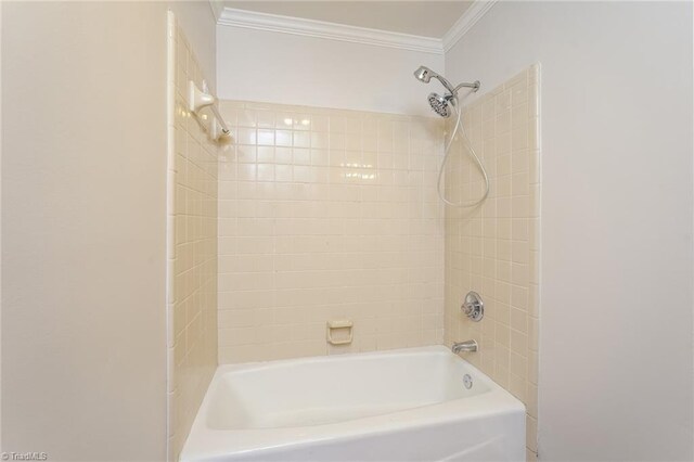 full bath with crown molding and shower / bath combination