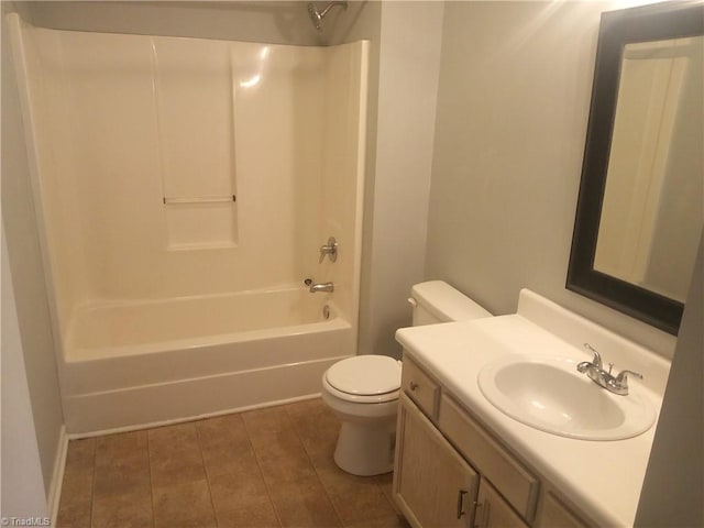 full bathroom featuring shower / tub combination, vanity, toilet, and tile patterned floors
