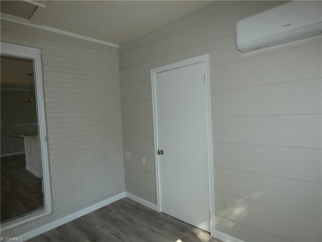 view of exterior entry with a wall mounted AC