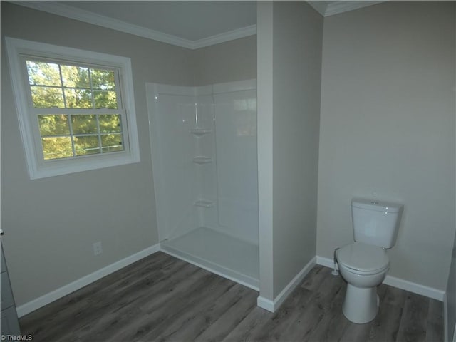 bathroom with toilet, a shower, wood-type flooring, and ornamental molding