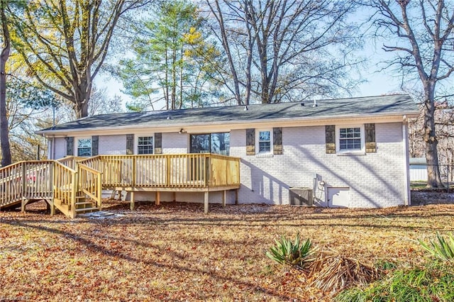 back of house featuring a deck and central air condition unit