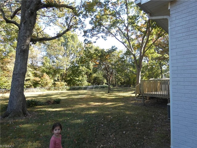 view of yard with a wooden deck