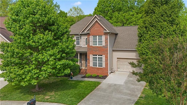 view of front of home featuring a garage, brick siding, a front lawn, and concrete driveway