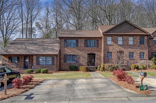 view of front of house featuring brick siding