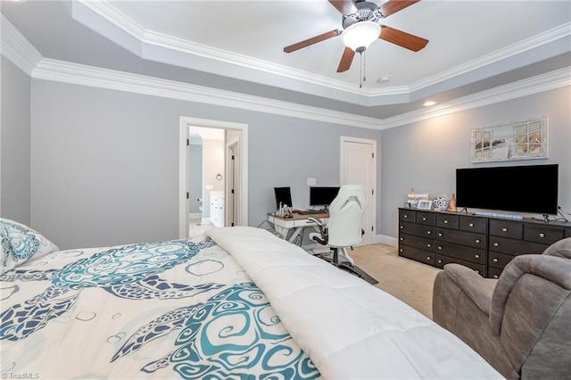 carpeted bedroom featuring baseboards, ornamental molding, a raised ceiling, and a ceiling fan