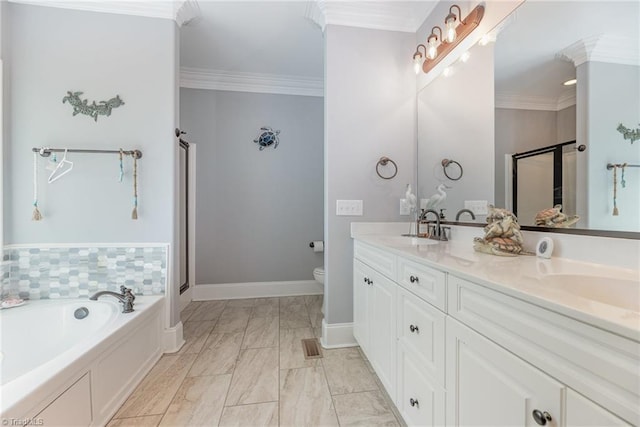 bathroom with a garden tub, double vanity, ornamental molding, a shower stall, and a sink