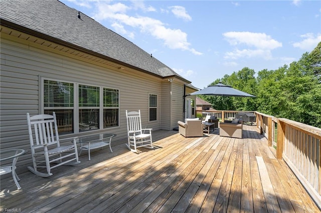 wooden terrace with outdoor lounge area