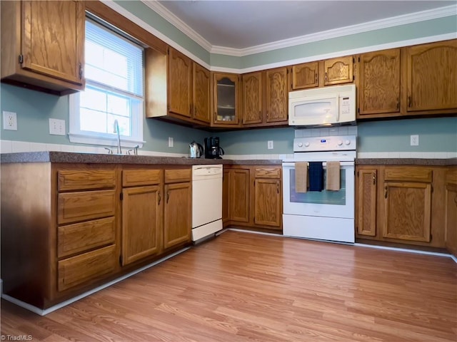 2065 Ardmore Village Ln, Winston-Salem, NC 27127 - kitchen featuring white appliances, brown cabinets, light wood-style flooring, and ornamental molding