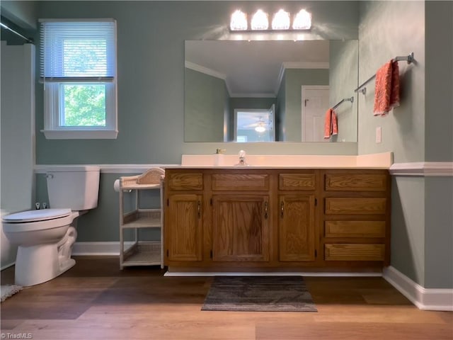 2065 Ardmore Village Ln, Winston-Salem, NC 27127 - bathroom with ornamental molding, toilet, wood finished floors, vanity, and ceiling fan