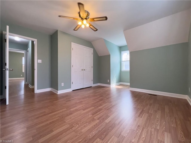 2065 Ardmore Village Ln, Winston-Salem, NC 27127 - additional living space with lofted ceiling, a ceiling fan, baseboards, and wood finished floors