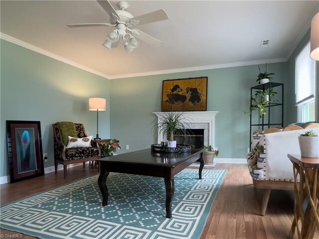 2065 Ardmore Village Ln, Winston-Salem, NC 27127 - living room with wood finished floors, ornamental molding, a fireplace, a ceiling fan, and baseboards