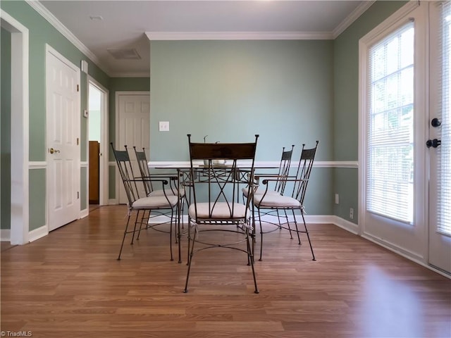 2065 Ardmore Village Ln, Winston-Salem, NC 27127 - dining room featuring wood finished floors, ornamental molding, and baseboards