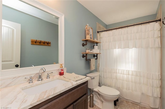 bathroom with vanity, tile patterned floors, toilet, and a shower with shower curtain