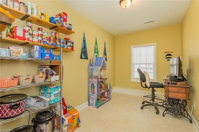 office area with visible vents and baseboards