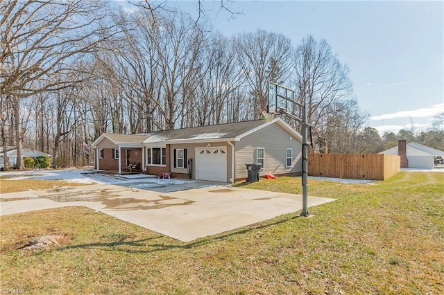 ranch-style house featuring concrete driveway, fence, a garage, and a front yard