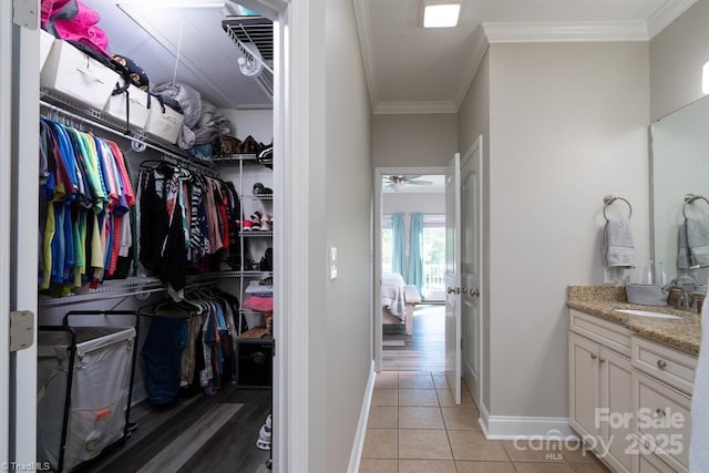 126 Strand Dr, New London, NC 28127 - walk in closet with a sink and light tile patterned flooring
