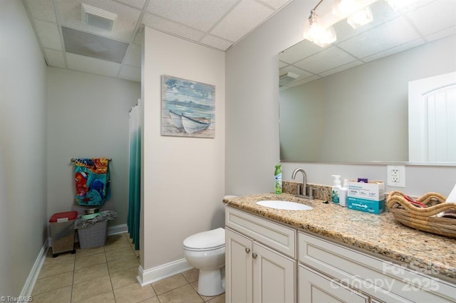 126 Strand Dr, New London, NC 28127 - bathroom featuring a paneled ceiling, vanity, tile patterned floors, toilet, and baseboards