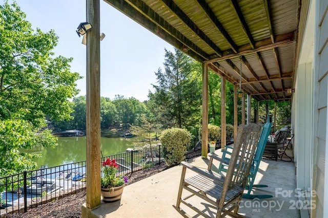 126 Strand Dr, New London, NC 28127 - view of patio featuring a water view and view of wooded area