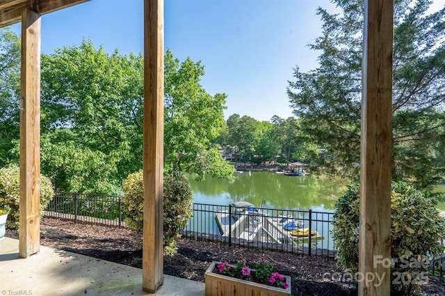 126 Strand Dr, New London, NC 28127 - view of patio featuring a water view and view of wooded area