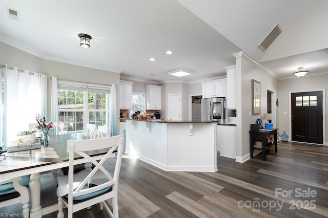 126 Strand Dr, New London, NC 28127 - kitchen with smart refrigerator, dark wood-type flooring, a peninsula, dark countertops, and recessed lighting