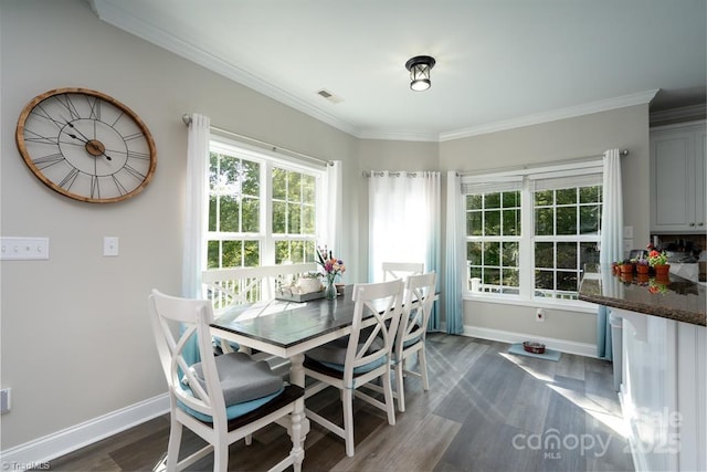 126 Strand Dr, New London, NC 28127 - dining room featuring baseboards, ornamental molding, and dark wood-style floors