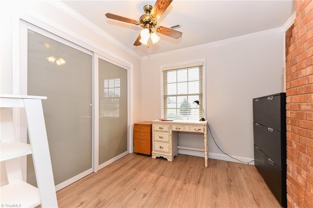 home office with crown molding, ceiling fan, and light hardwood / wood-style flooring