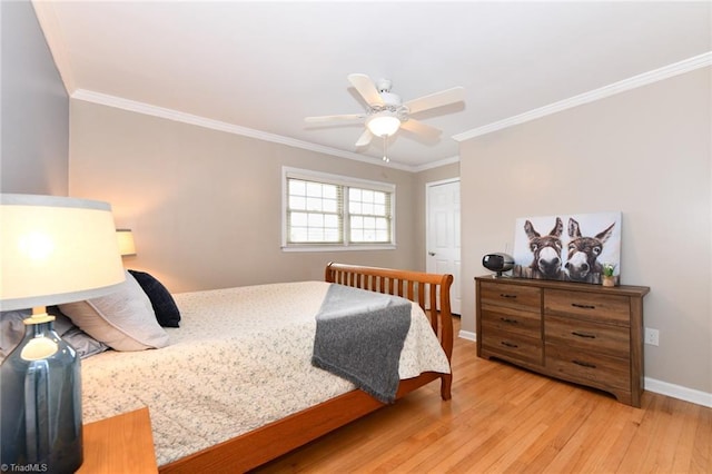 bedroom featuring ornamental molding, hardwood / wood-style floors, and ceiling fan