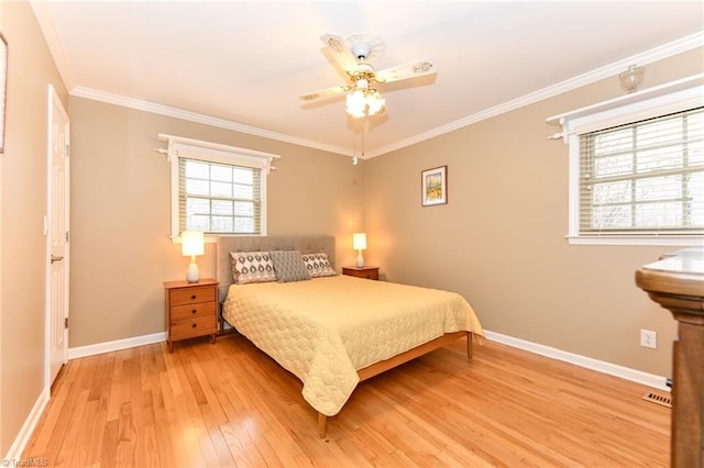 bedroom featuring crown molding, wood-type flooring, and ceiling fan