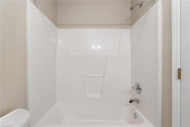 full bathroom with shower / washtub combination and toilet