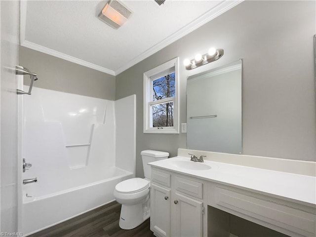 full bathroom featuring vanity, hardwood / wood-style floors, shower / bathing tub combination, a textured ceiling, and toilet