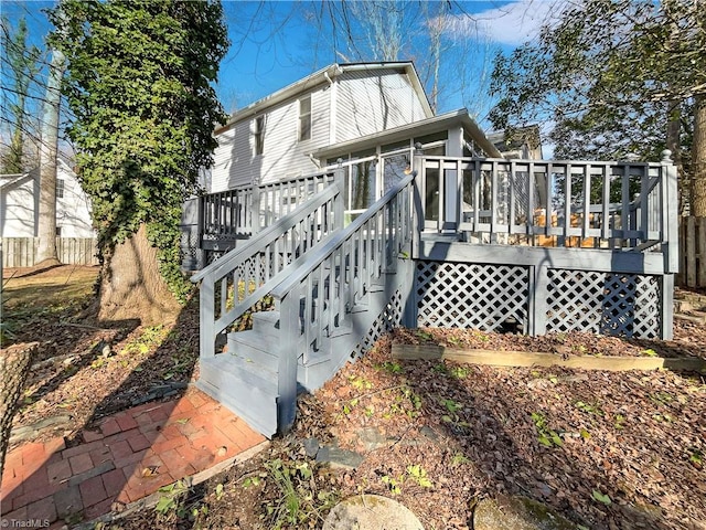 view of home's exterior with a wooden deck