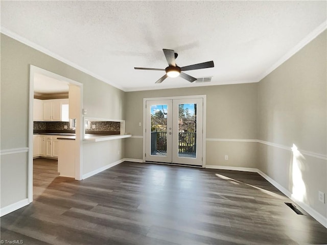 unfurnished room featuring ceiling fan, a textured ceiling, ornamental molding, dark hardwood / wood-style floors, and french doors