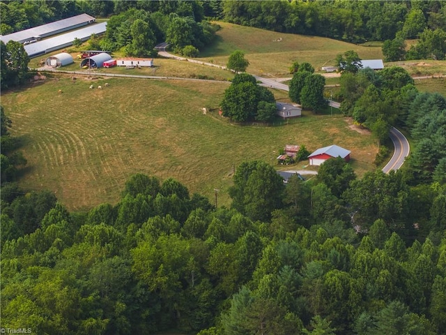 birds eye view of property with a rural view