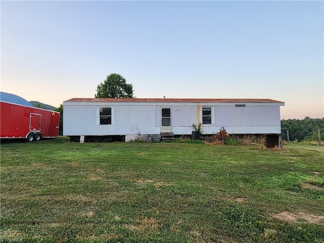 view of front of home with a yard