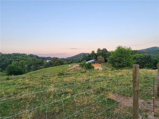 view of mountain feature with a rural view