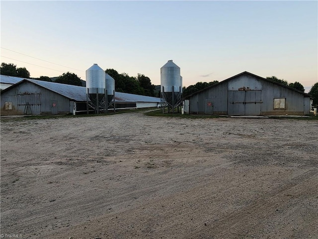 yard at dusk with an outdoor structure