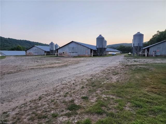 yard at dusk with an outdoor structure