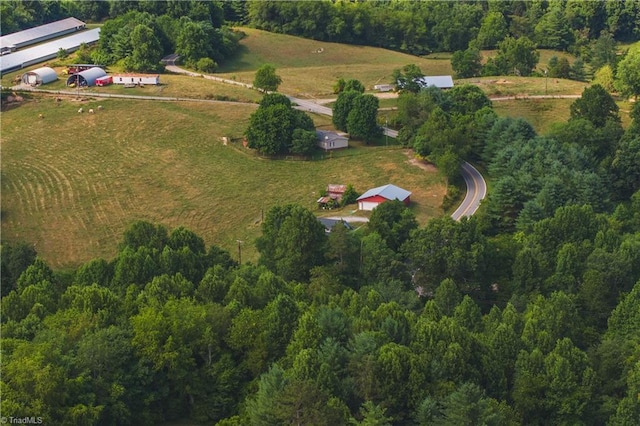 birds eye view of property with a rural view