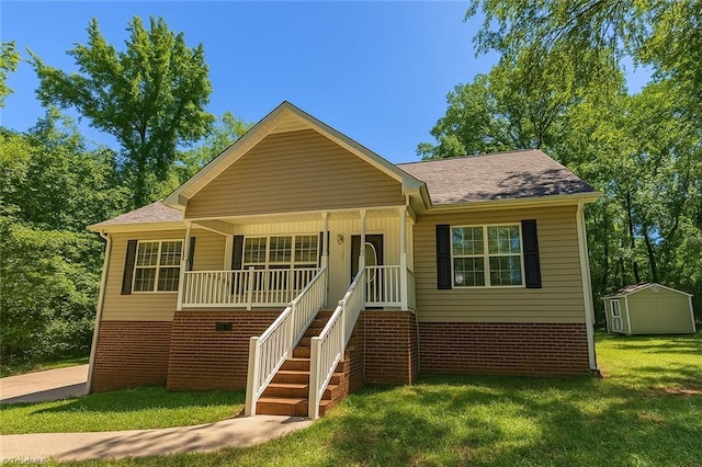 162 N Hazelwood Dr, Mocksville, NC 27028 - bungalow-style home featuring brick siding, a front yard, a storage shed, and roof with shingles