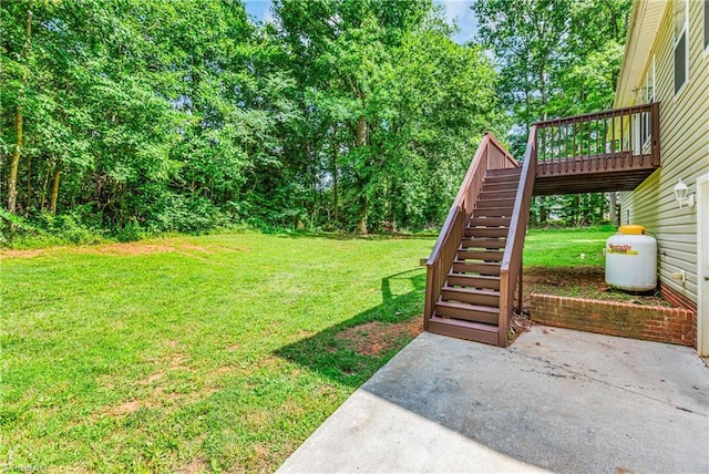 162 N Hazelwood Dr, Mocksville, NC 27028 - view of green lawn with stairs, a patio, and a deck