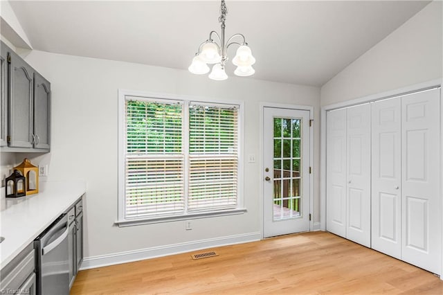 162 N Hazelwood Dr, Mocksville, NC 27028 - unfurnished dining area with a chandelier, light wood-style floors, and lofted ceiling
