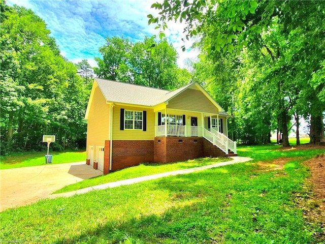 162 N Hazelwood Dr, Mocksville, NC 27028 - view of front of property featuring a porch, driveway, a front lawn, an attached garage, and stairs