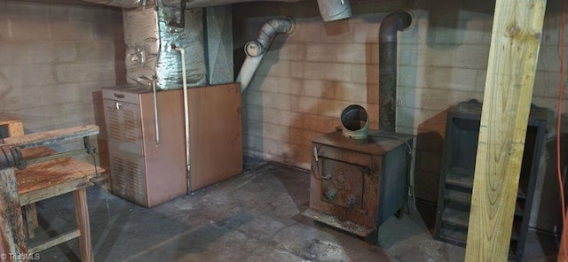 utility room featuring heating unit